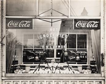 (ADVERTISING & STORE WINDOWS--FRUIT) A collection of 27 advertising and display photographs related to the Florida orange and citrus in